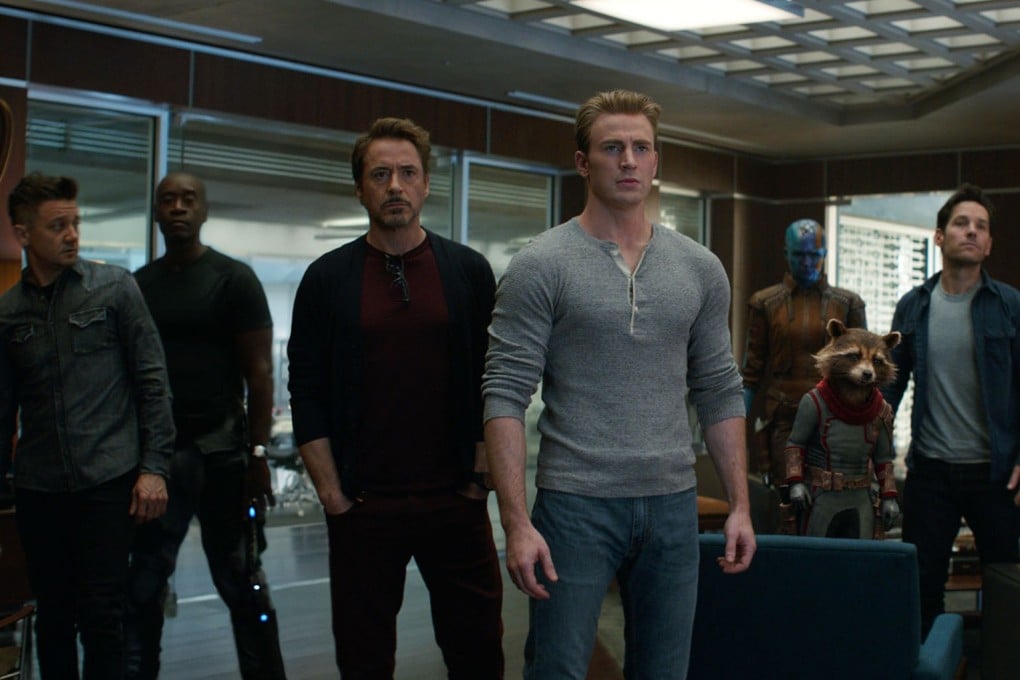 This image released by Disney shows, from left, Jeremy Renner, Don Cheadle, Robert Downey Jr., Chris Evans, Karen Gillan, the character Rocket, voiced by Bradley Cooper, Paul Rudd and Scarlett Johansson in a scene from “Avengers: Endgame.” (Disney/Marvel Studios via AP)