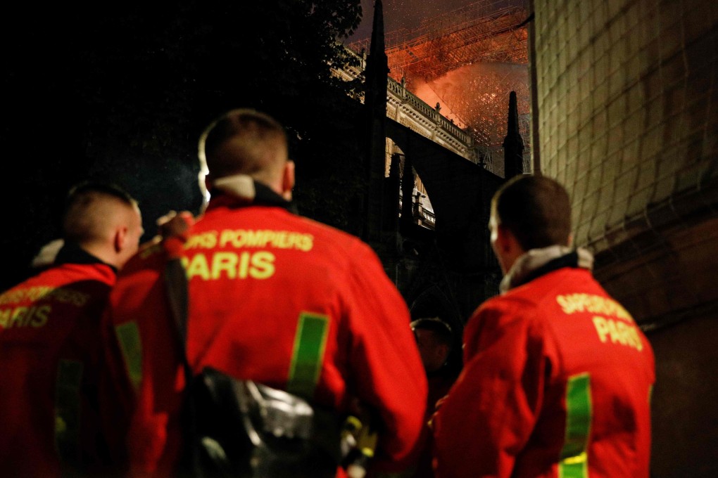 Firefighters at Notre Dame Cathedral in Paris on April 15. Photo: AFP