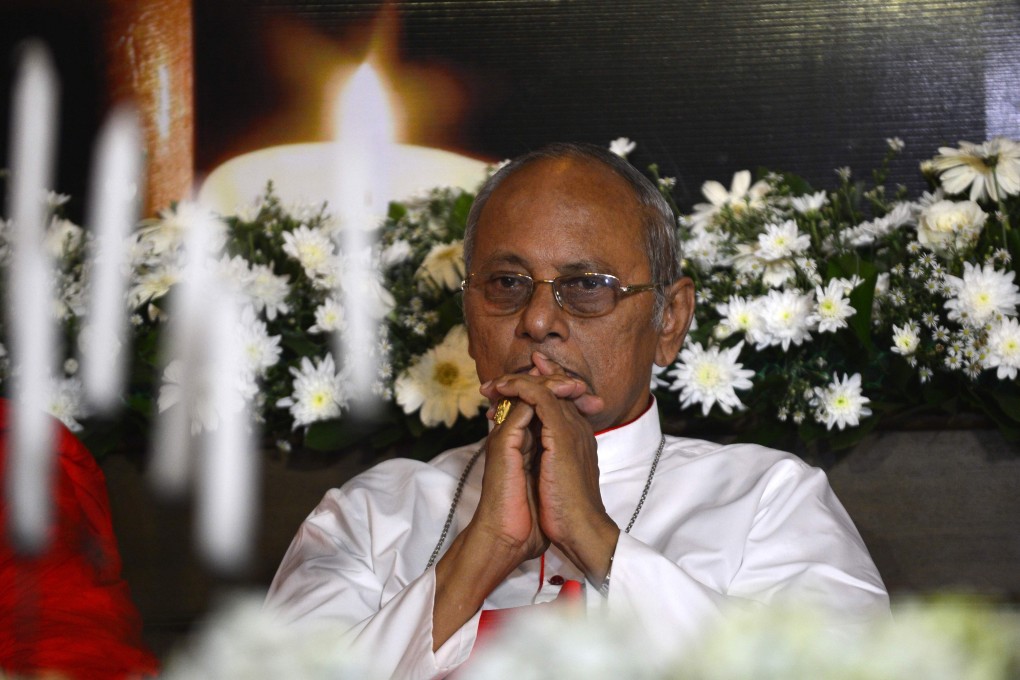 Cardinal Malcolm Ranjith at a candlelight vigil in memory of bombing victims in Colombo on Sunday. Photo: AFP