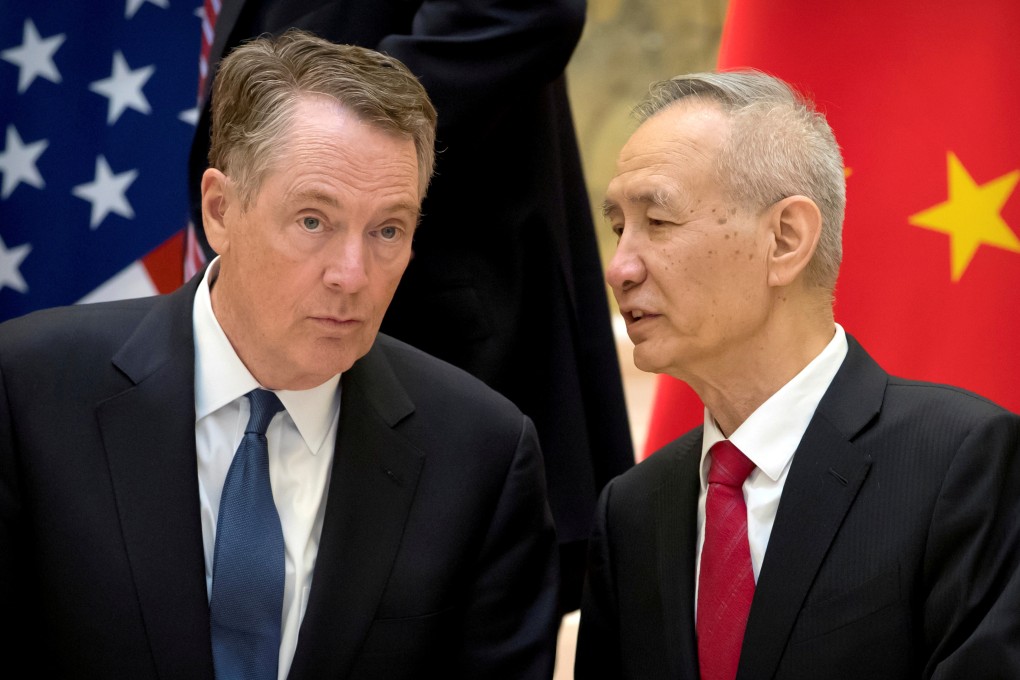 US Trade Representative Robert Lighthizer (left) listens as Chinese Vice-Premier Liu He speaks while they line up for a group photo in Beijing in February. Photo: Reuters