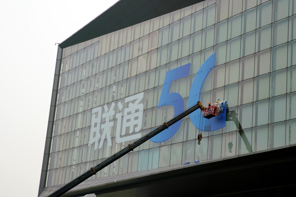 Signs for 5G and China Unicom are seen on a building in the Pudong district in Shanghai. Photo: Reuters