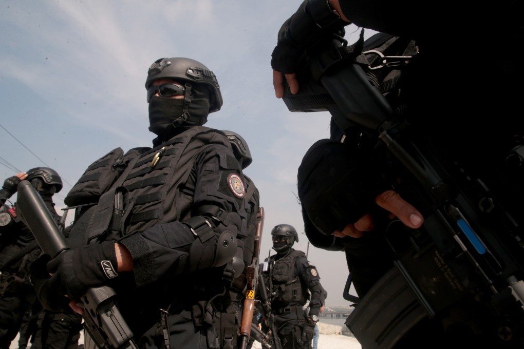 An Indonesian anti-terror team stand in formation during a drill in Jakarta. Photo: EPA