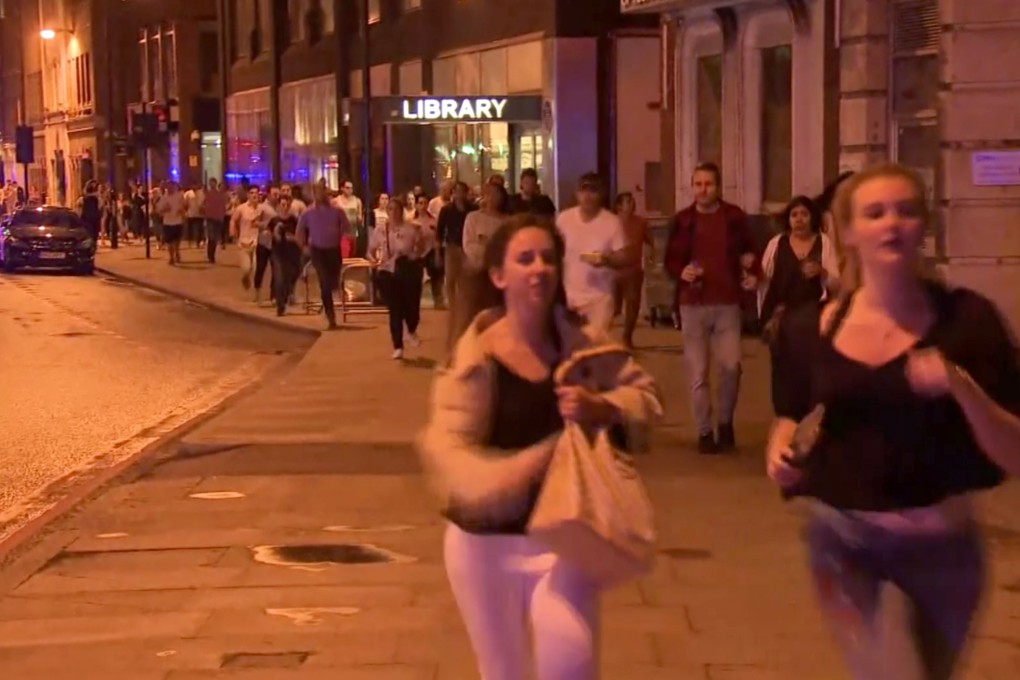 A still of a video showing people running from the scene of the attack in London on June 3, 2017. Photo: AP