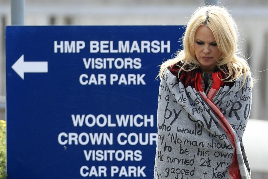 US actress Pamela Anderson leaves Belmarsh Prison in London after visiting WikiLeaks founder Julian Assange on Tuesday. Photo: PA via AP