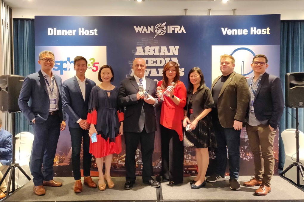 (Left to right) Elgen Kua, PR director; Gary Liu, CEO; Elsie Cheung, chief operating officer; Carl Jones, head of newspaper design; Zuraidah Ibrahim, deputy executive editor; Tammy Tam, editor-in-chief; Ian Hocking, digital advertising director; and infographic designer Pablo Robles at the WAN-IFRA Asian Media Awards in Singapore. Photo: SCMP