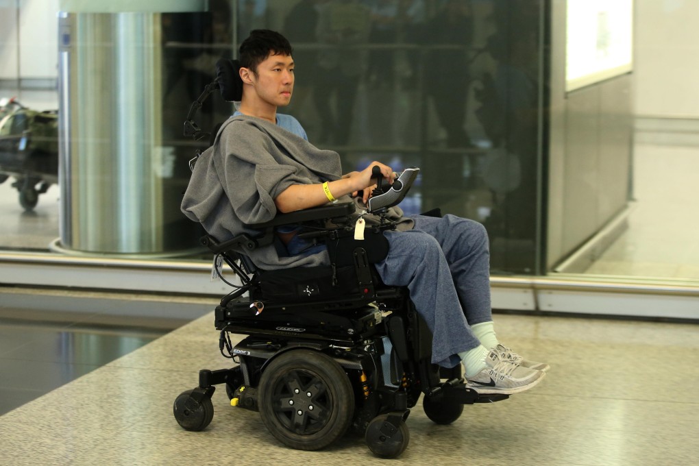 Jesher Yau in his electric wheelchair at Hong Kong International Airport on his way to Princess Margaret Hospital. Photo: Handout