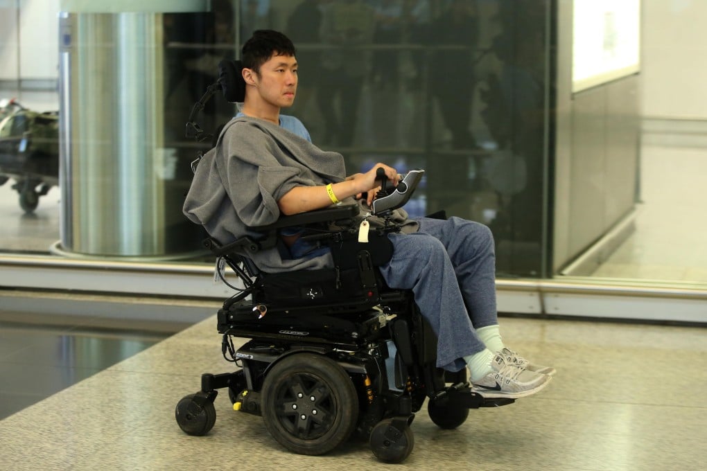 Jesher Yau in his electric wheelchair at Hong Kong International Airport on his way to Princess Margaret Hospital. Photo: Handout