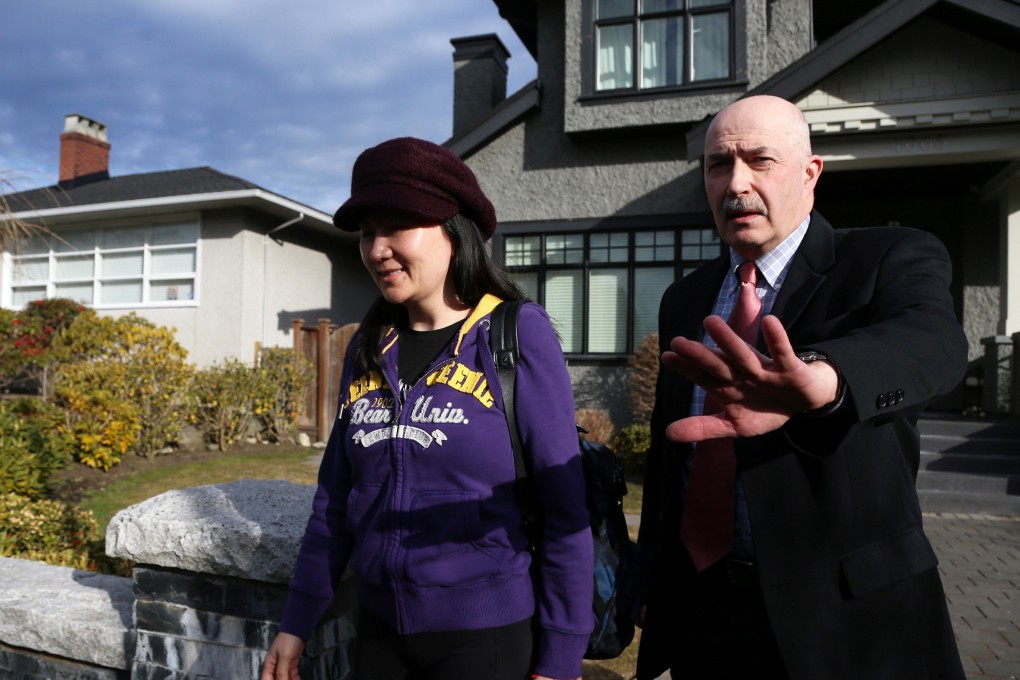 Huawei's CFO Meng Wanzhou leaves her home in Vancouver, accompanied by a guard from Lions Gate Risk Management, on March 6. Photo: Reuters