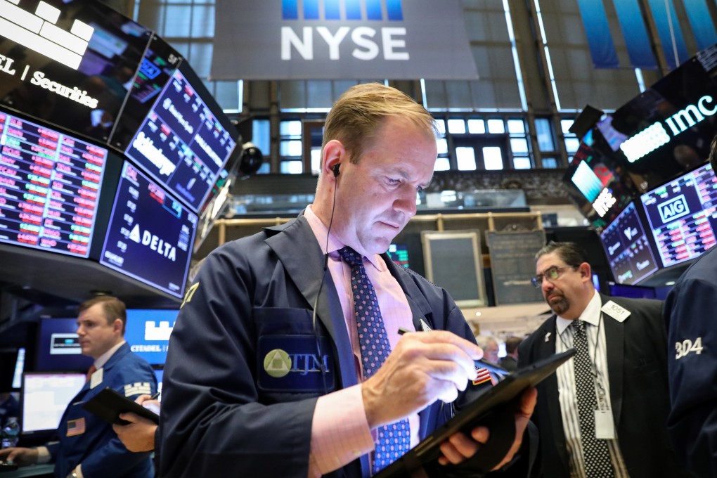 Traders work on the floor at the New York Stock Exchange on Tuesday. Photo: Reuters