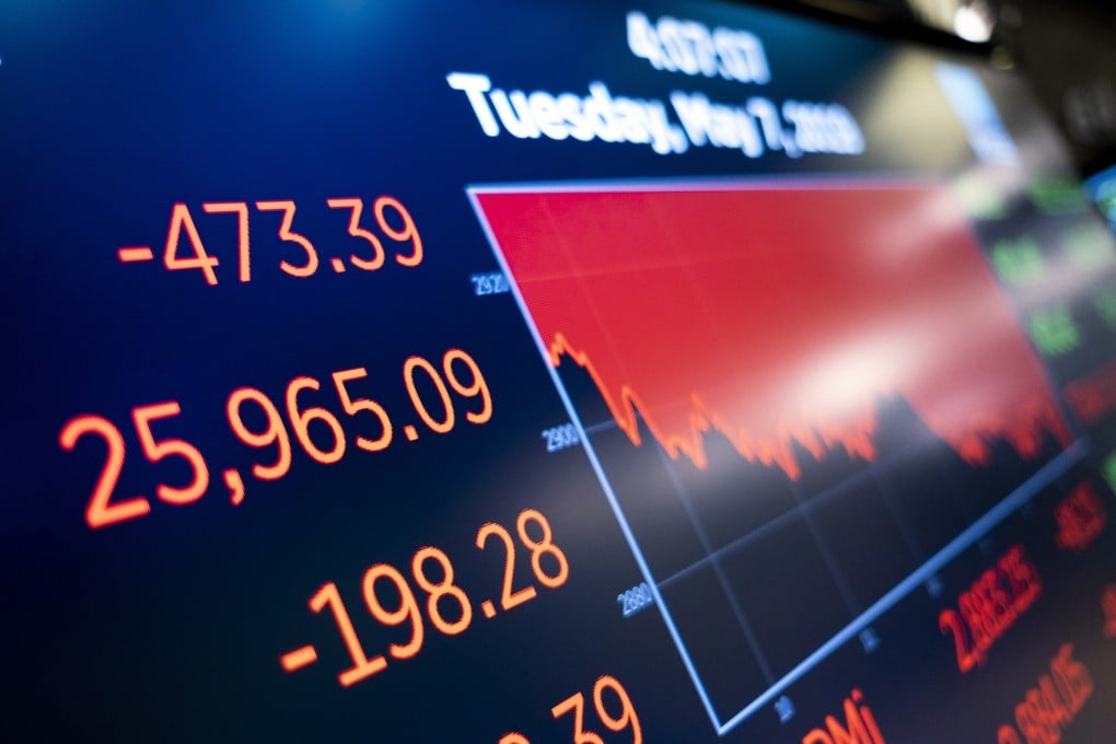 A screen shows the Dow Jones Industrial Average at the end of the day at the New York Stock Exchange on Tuesday, as markets continued to react to uncertainty surrounding trade negotiations between the United States and China. Photo: EPA-EFE