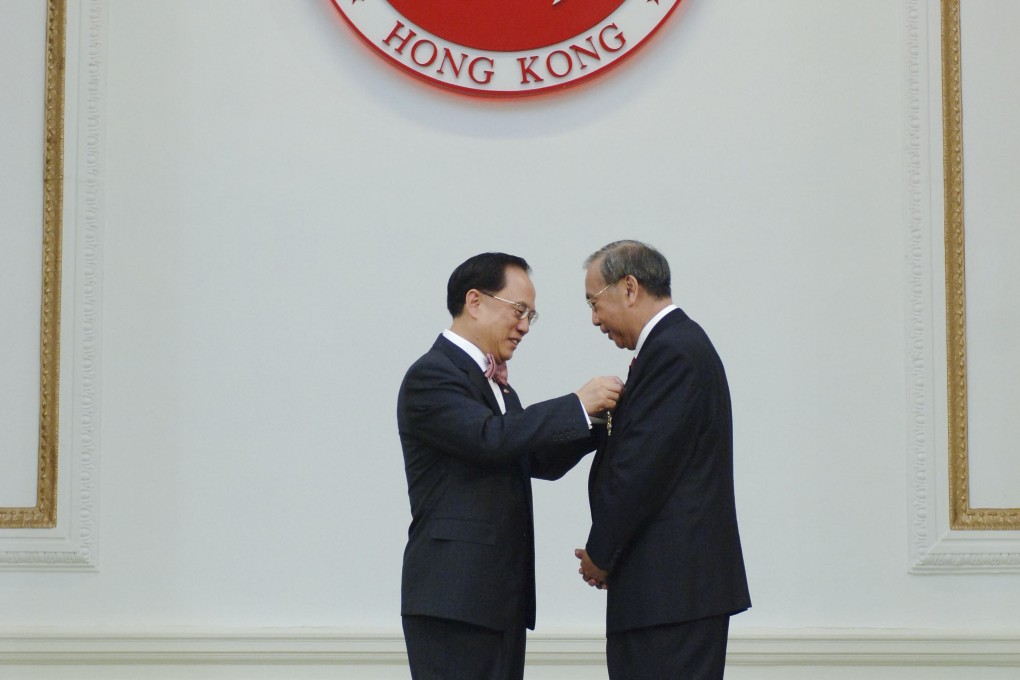 Donald Tsang (left), Hong Kong’s then chief executive, presents the Grand Bauhinia Medal to former chief secretary Rafael Hui, at Government House, in 2007. Hui was later stripped of the honour. Both Tsang and Hui have been convicted of misconduct in public office. Photo: ISD