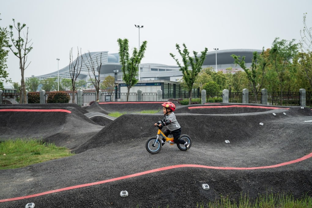 Two-year-old Xiao Kaixi, an only child, learns to ride a bike in Wuhan, China. Years after the country abolished its one-child policy, many couples are reluctant to expand their families. Photo: Yan Cong / The Washington Post