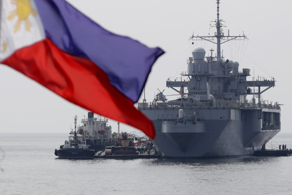 The USS Blue Ridge, flagship of the US 7th fleet, anchored off Manila Bay in the Philippines for a routine port call on March 13. Under the new calculus, if the Philippine military were attacked by Chinese militia — essentially fishing boats backed by coastguard vessels — the treaty-bound US would be obligated to strike back. Photo: AP
