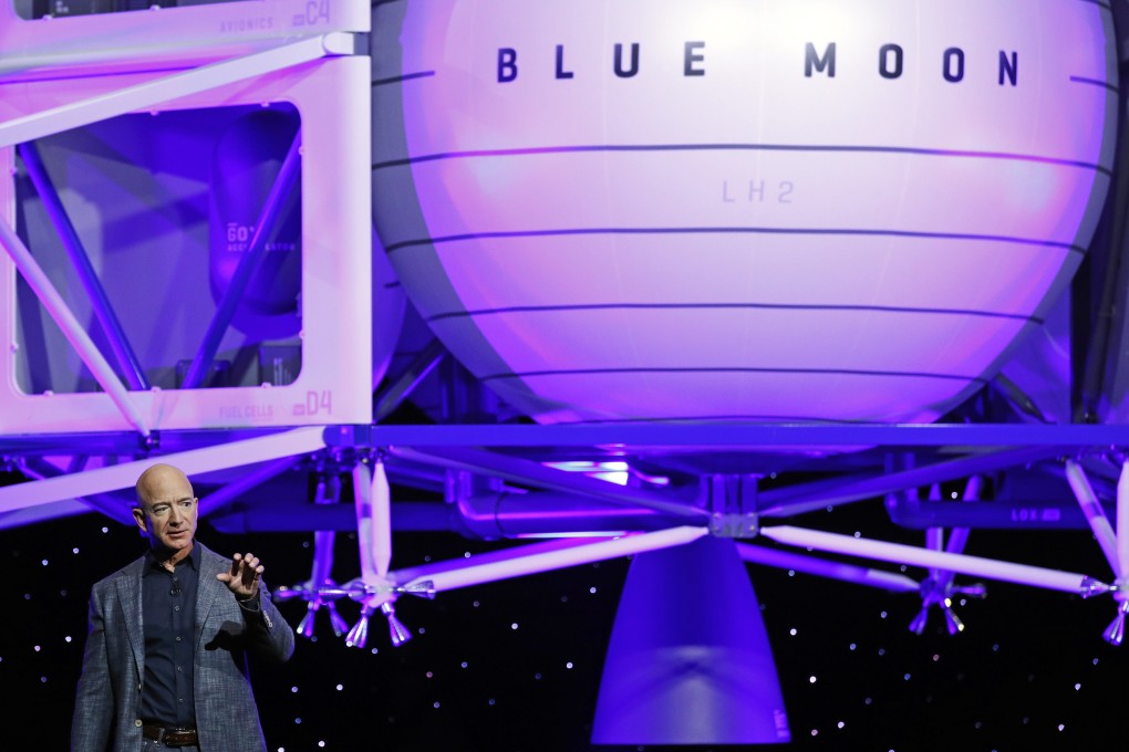 Jeff Bezos speaks in front of a model of Blue Origin's Blue Moon lunar lander on Thursday. Photo: AP