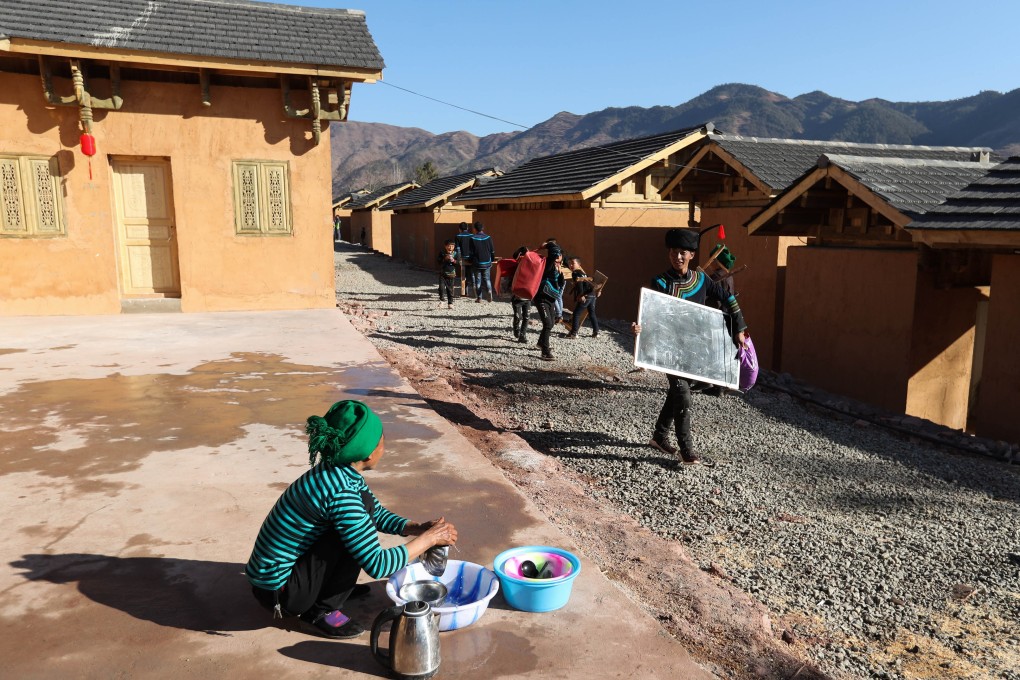 Villagers of the Yi ethnic group move into new houses for relocated residents from poor areas, in Zhaojue county in southwest China’s Sichuan province. Under President Xi Jinping, China has set the goal of eliminating poverty by 2020, but the state of the rural poor in remote counties may make the task difficult. Photo: Xinhua