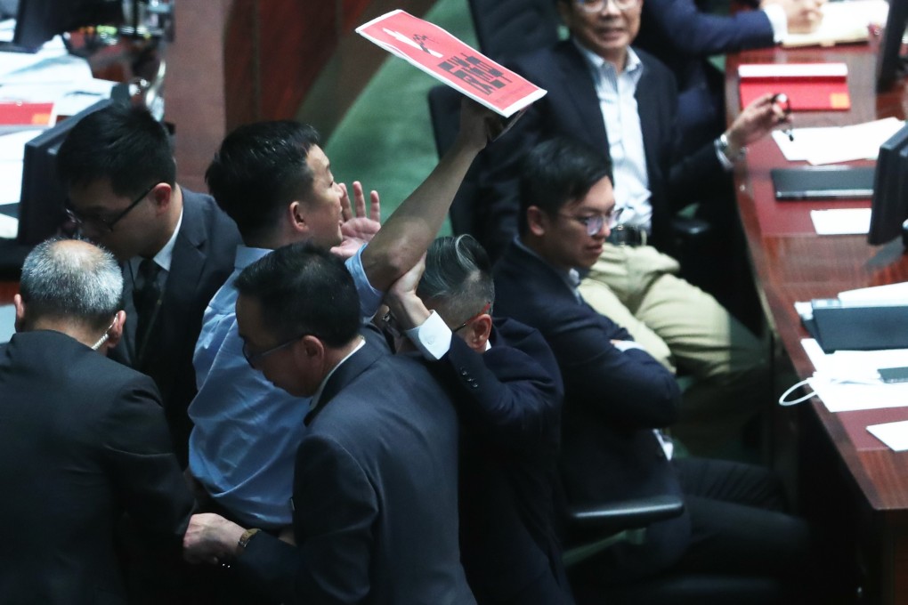 Raymond Chan protests against Chief Executive Carrie Lam during a debate on the contentious extradition bill. Photo: Sam Tsang