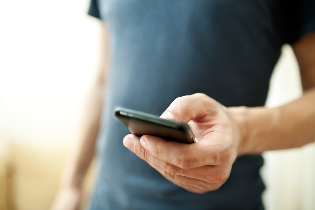 A man using mobile phone. Photo: Shutterstock