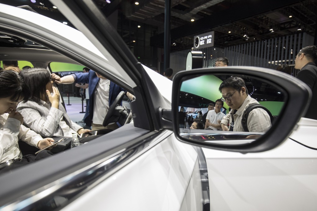 Attendees look at an electric sport utility vehicle on display at last month’s Auto Shanghai 2019 show in China. Photo: Bloomberg