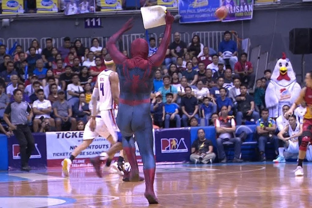 ‘Spider-Man’ runs on to the court to pull off his stunt. Photo: YouTube