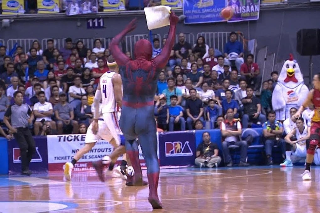 ‘Spider-Man’ runs on to the court to pull off his stunt. Photo: YouTube