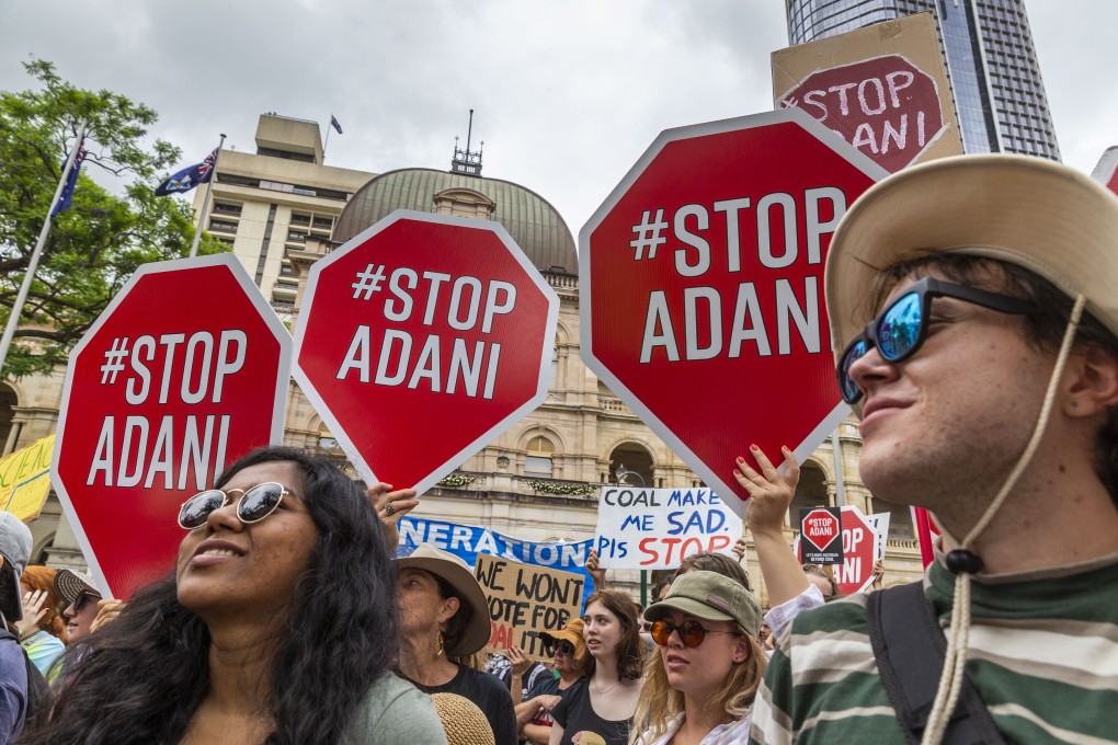 People protest outside Queensland Parliament House in Brisbane. Photo: EPA