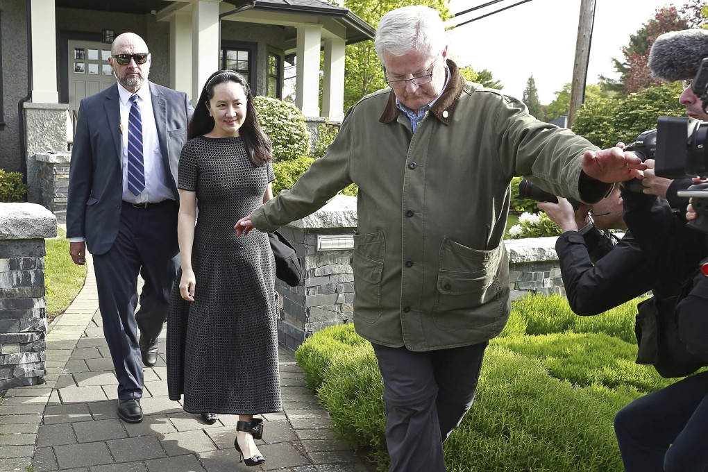 Huawei Technologies Chief Financial Officer Meng Wanzhou wears an electronic monitoring device on her ankle as she is escorted by security from her home on May 8, 2019 in Vancouver, Canada. Photo: AFP