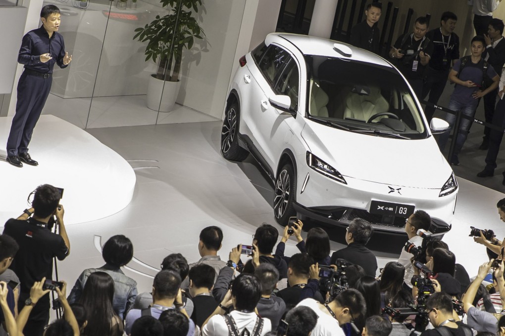 He Xiaopeng, chairman and co-founder of Xpeng Motors Technology Ltd., with the company's G3 electric sport utility vehicle at the Guangzhou International Automobile Exhibition last November. Photo: Bloomberg