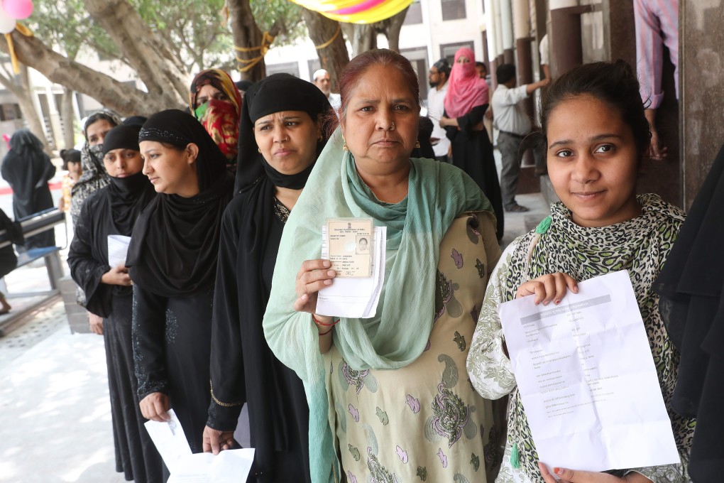 Muslim women queue up to cast their votes at a polling station in Delhi, the capital of India, on May 12. The ruling BJP, a hardline Hindu party led by Prime Minister Narendra Modi, has been accused of stoking anti-Muslim violence and hate crimes. Photo: EPA-EFE