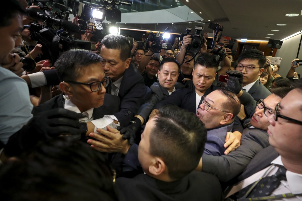 Abraham Razack attempts to enter the bills committee meeting at the Legislative Council. Photo: Sam Tsang