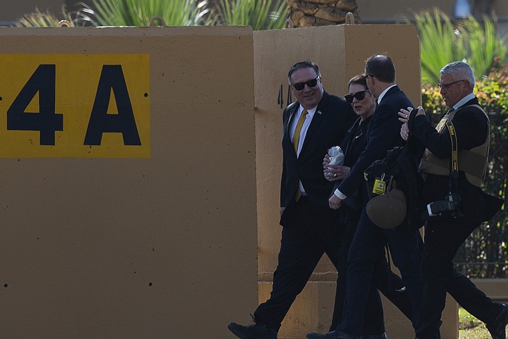 US Secretary of State Mike Pompeo and his wife Susan walk at the US Embassy compound in Baghdad. Photo: Reuters
