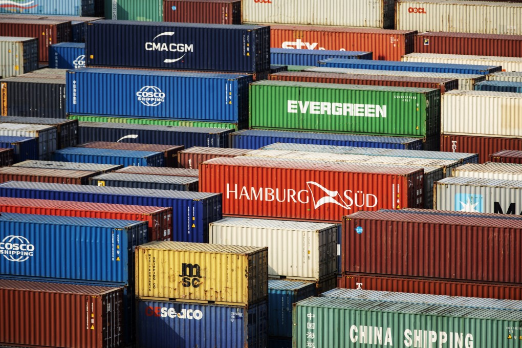 Shipping containers sit stacked at the Yangshan Deepwater Port, operated by Shanghai International Port Group in Shanghai, China, on May 10, 2019. Photo: Bloomberg