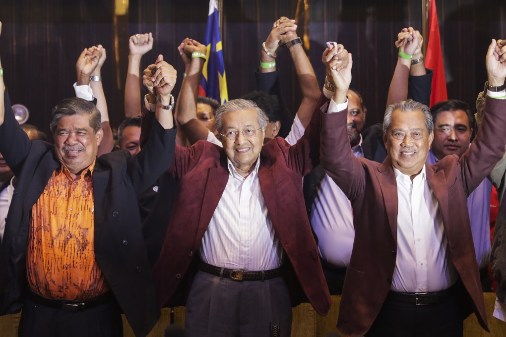 Malaysian Prime Minister Mahathir Mohamad (centre) and other members of Pakatan Harapan celebrate after last year’s elections. Photo: EPA