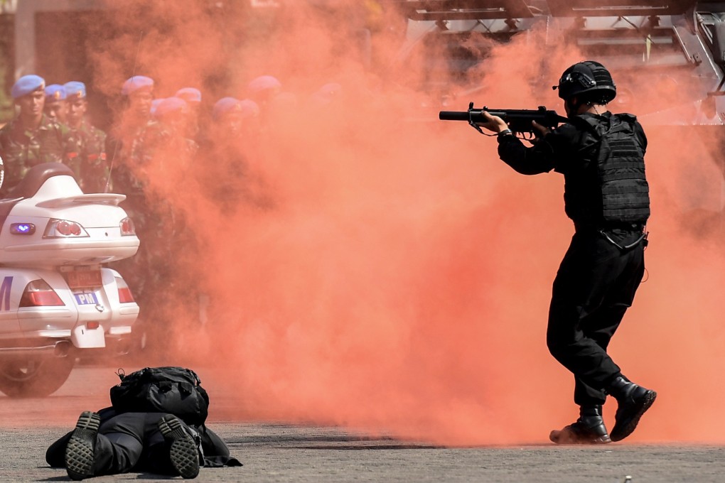 Presidential security squads take part in a drill ahead of the announcement of election results in Jakarta. Photo: Reuters