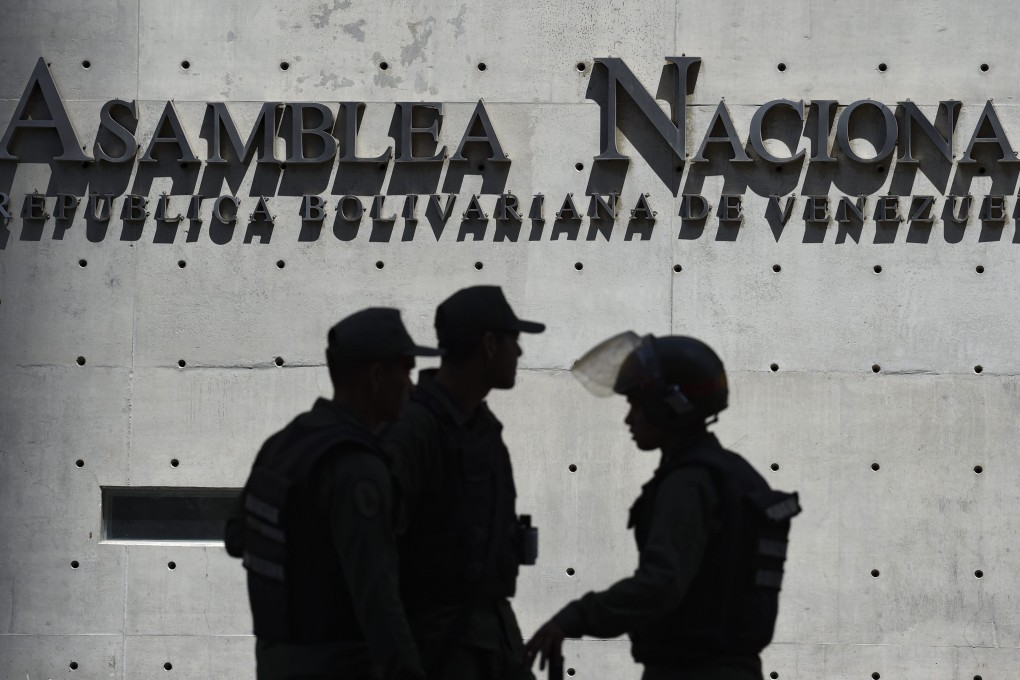 Members of Venezuela's Bolivarian National Guard block access to the Federal Legislative Palace. Photo: AFP