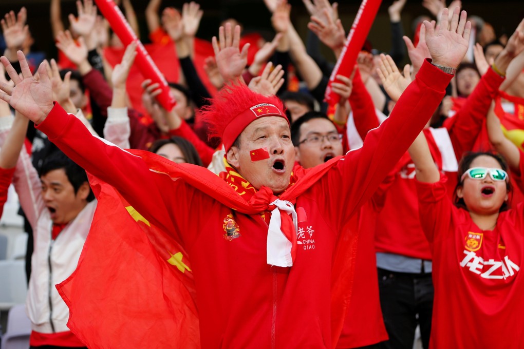 China fans cheer their team on against Thailand at the 2019 Asian Cup in the UAE. Photo: Reuters