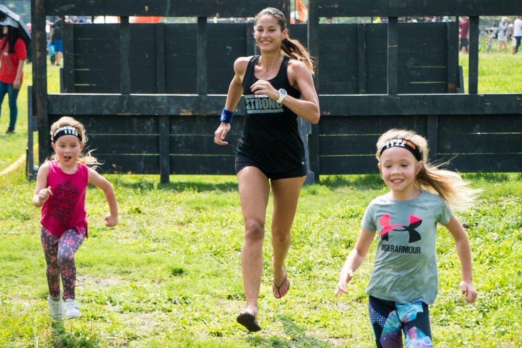 Danielle Roman (centre) with her daughters Angelie and Serena at a Spartan race in May