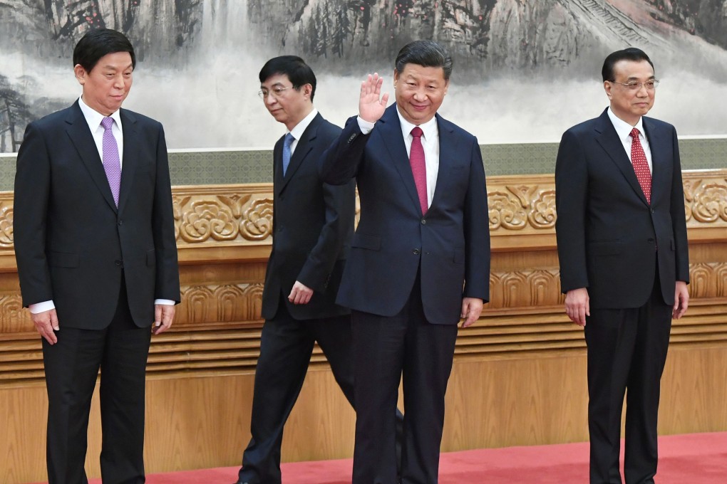Chinese President Xi Jinping waves to reporters from the podium with members of his leadership team including Premier Li Keqiang, Li Zhanshu, and Wang Huning at the Great Hall of the People in Beijing. Photo: Kyodo