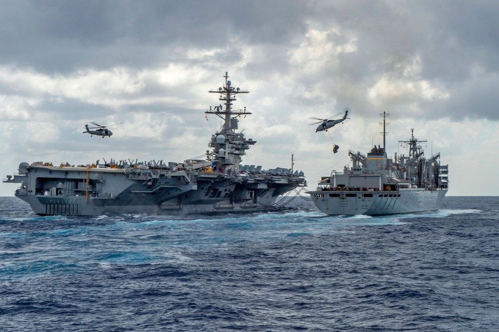 The Nimitz-class aircraft carrier USS Abraham Lincoln (CVN 72) while conducting a replenishment-at-sea with the fast combat support ship USNS Arctic (T-AOE 9). Photo: Navy Office of Information / AFP