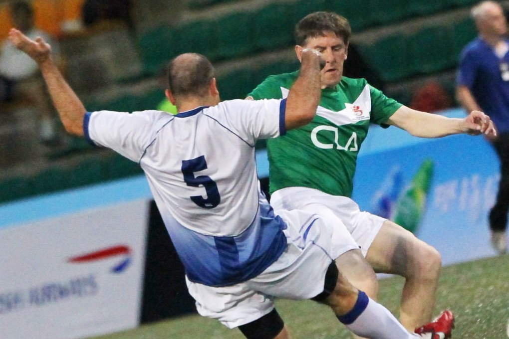 Peter Beardsley (right) takes part in the 2013 Hong Kong Soccer Sevens. Photo: SCMP/Edward Wong