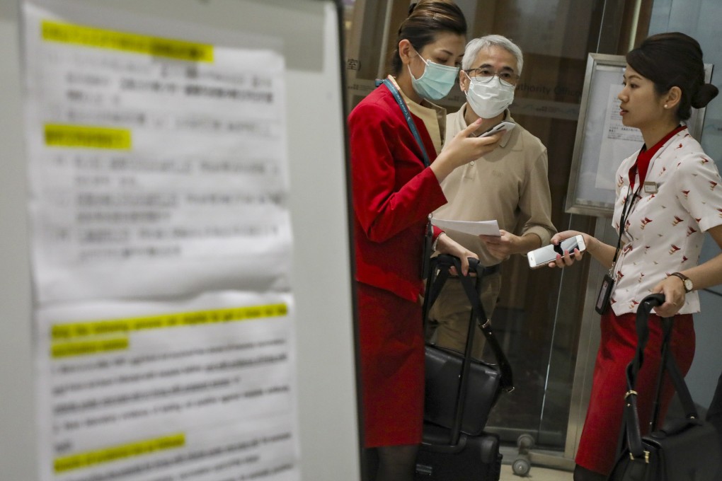 Airline staff queue up for the measles vaccination at Hong Kong’s airport. Photo: Felix Wong