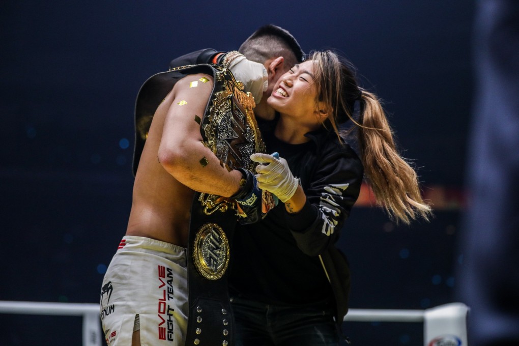 Angela Lee hugs her brother Christian Lee after his lightweight title win. Photo: One Championship
