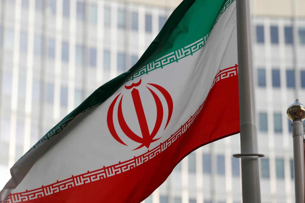 The Iranian flag flutters in front the International Atomic Energy Agency (IAEA) headquarters in Vienna. Photo: Reuters