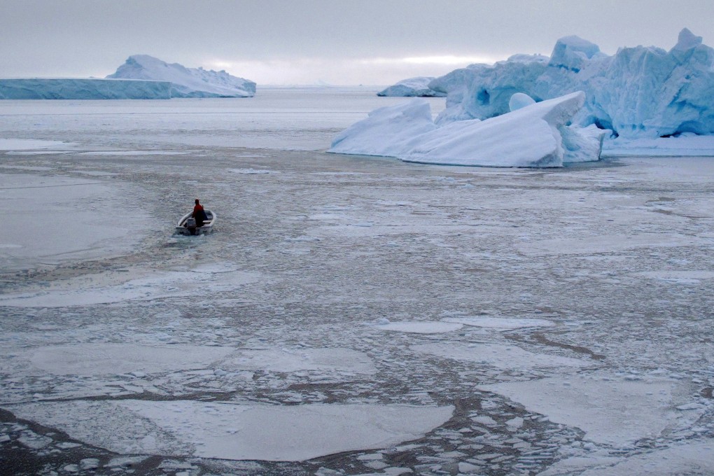 A small fishing boat heads out into the sea ice near the town of Uummannaq in western Greenland in March 2010. As a result of climate change, a sea route has opened up in the Arctic that could draw ships away from the Suez canal. Photo: Reuters