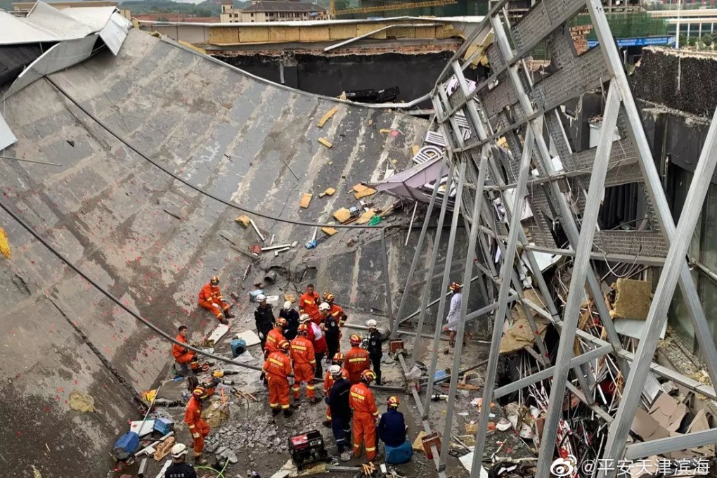 Rescuers assess the damage after the roof of a bar in Baise, Guangxi, collapsed, killing three people. Photo: Handout