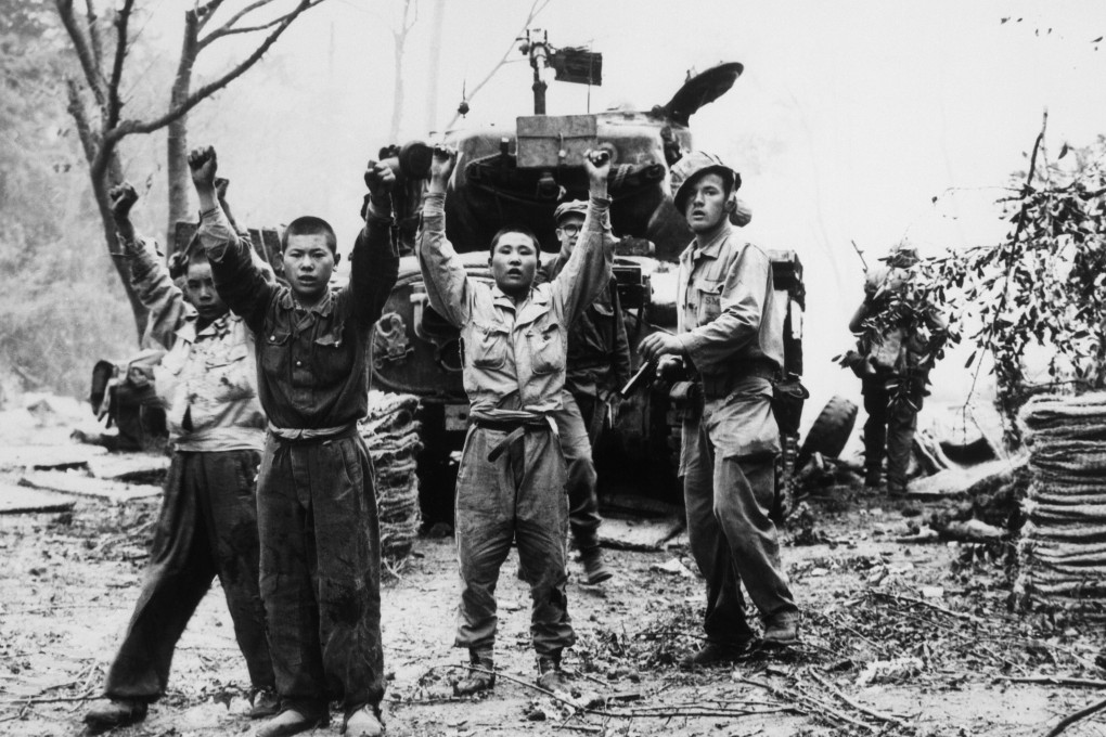 A US marine with North Korean prisoners of war in Korea in 1953. Photo: Alamy