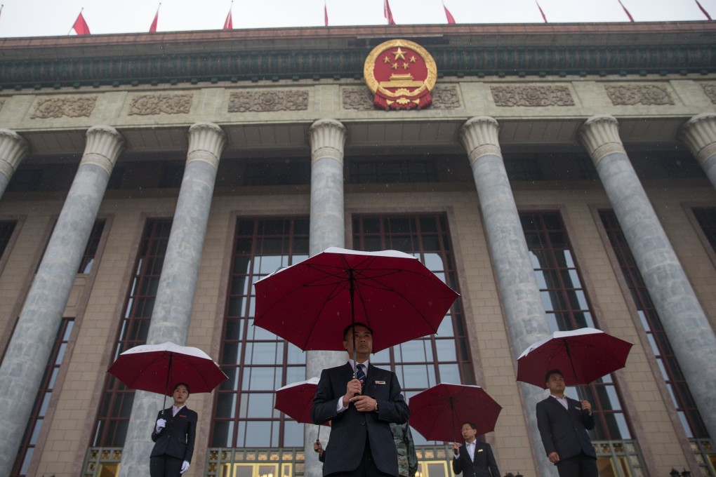 China is prepared for the global turbulence with its decades-long use of five-year plans, the latest of which was made in 2017, at the Great Hall of the People in Beijing, seen here on October 18, with security officers standing guard before the opening ceremony of the 19th National Congress of the Communist Party of China. Photo: EPA-EFE