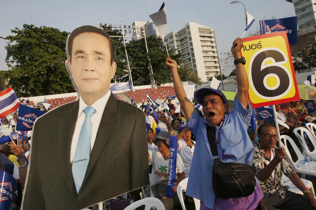 Supporters of the Palang Pracharat Party hold a poster of the Thai Prime Minister Prayuth Chan-ocha during a rally in Bangkok. Photo: AP