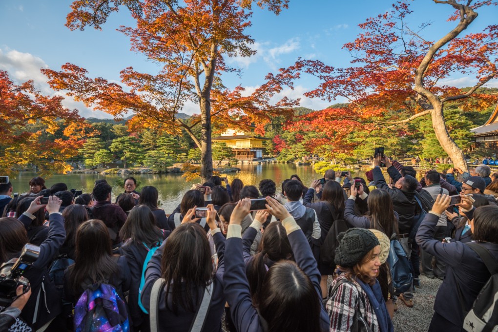 The people-packed reality at Kyoto’s Kinkaku-ji is very different from the peaceful pictures posted on Instagram. Photo: Shutterstock