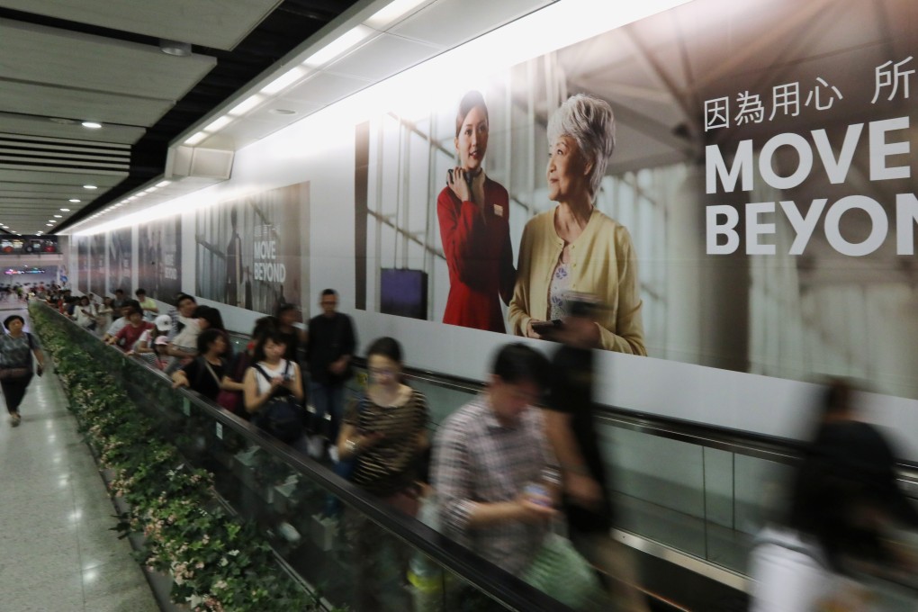 Part of Cathay Pacific’s new ad campaign is displayed at the MTR station in Central. Photo: Felix Wong