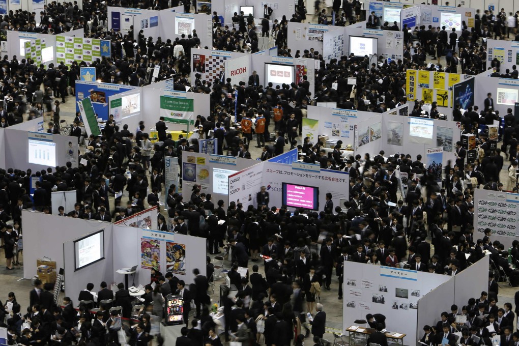 Japanese graduates attend a job fair in Tokyo. Photo: Reuters